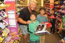 Giving Children Shoes at Payless